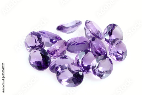 Natural gemstone purple amethyst on white background