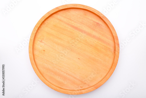 round wooden cutting board isolated on a white background