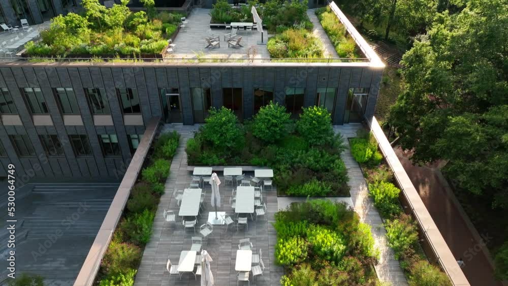 Health outdoor city living. Rooftop garden and seating areas with green plants growing in American city. USA Charlottesville Virginia. Health outdoor city living. Rooftop garden and seating areas with green plants growing in American city. USA Charlottesville Virginia.