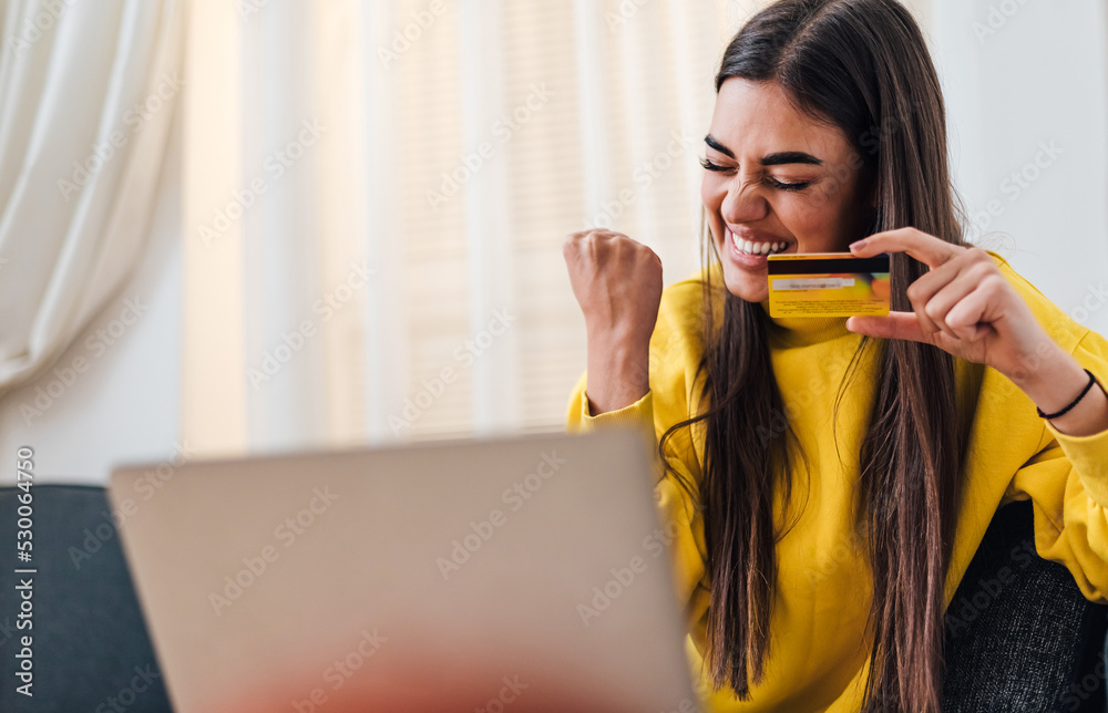 Cheerful adult young woman, happy with her online purchase. Cheerful adult young woman, happy with her online purchase.