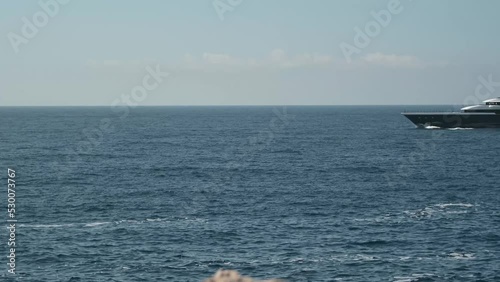 A high end yacht with no name sailing on the Adriatic sea past the Island of Lokrum in Dubrovnik. 