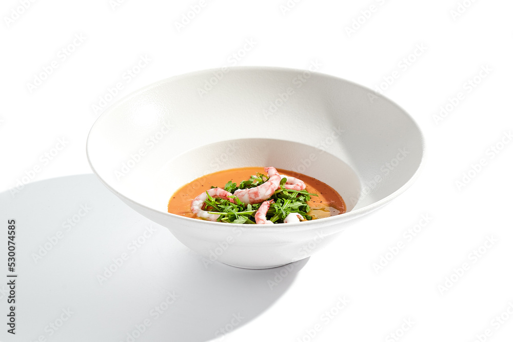 Summer Spanish soup gazpacho with shrimp and rocket salad isolated on white background. Healthy cold tomato soup with prawns. Clean eating for diet.Healthy food in restaurant menu. Seafood gazpacho Summer Spanish soup gazpacho with shrimp and rocket salad isolated on white background. Healthy cold tomato soup with prawns. Clean eating for diet.Healthy food in restaurant menu. Seafood gazpacho