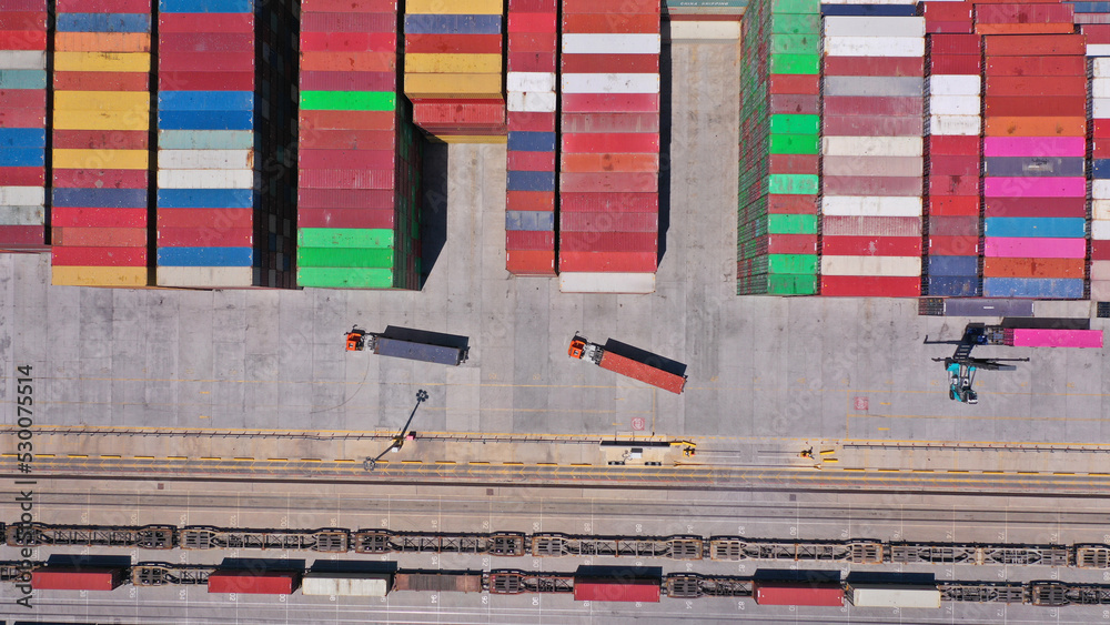 Aerial drone top down photo of colourful containers stacked in ...