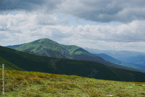 Mountain landscape with clouds, wildlife