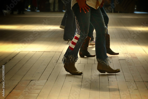 Legs close up of traditional western folk music dancers blur dynamism effect