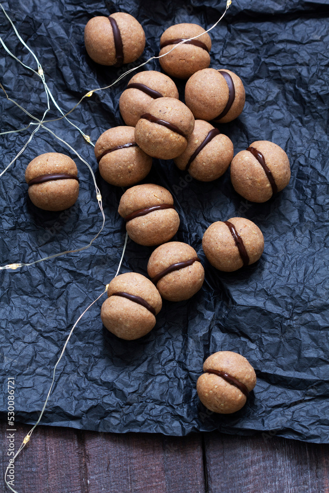 Lady's kisses, traditional Italian nut cookies with coffee and chocolate filling.