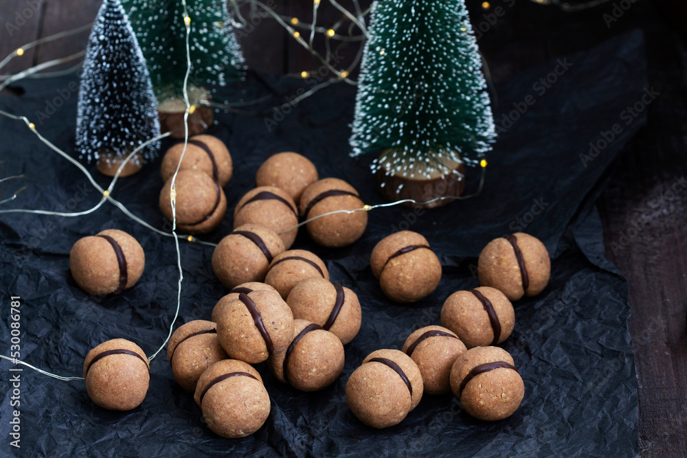 Lady's kisses, traditional Italian nut cookies with coffee and chocolate filling.