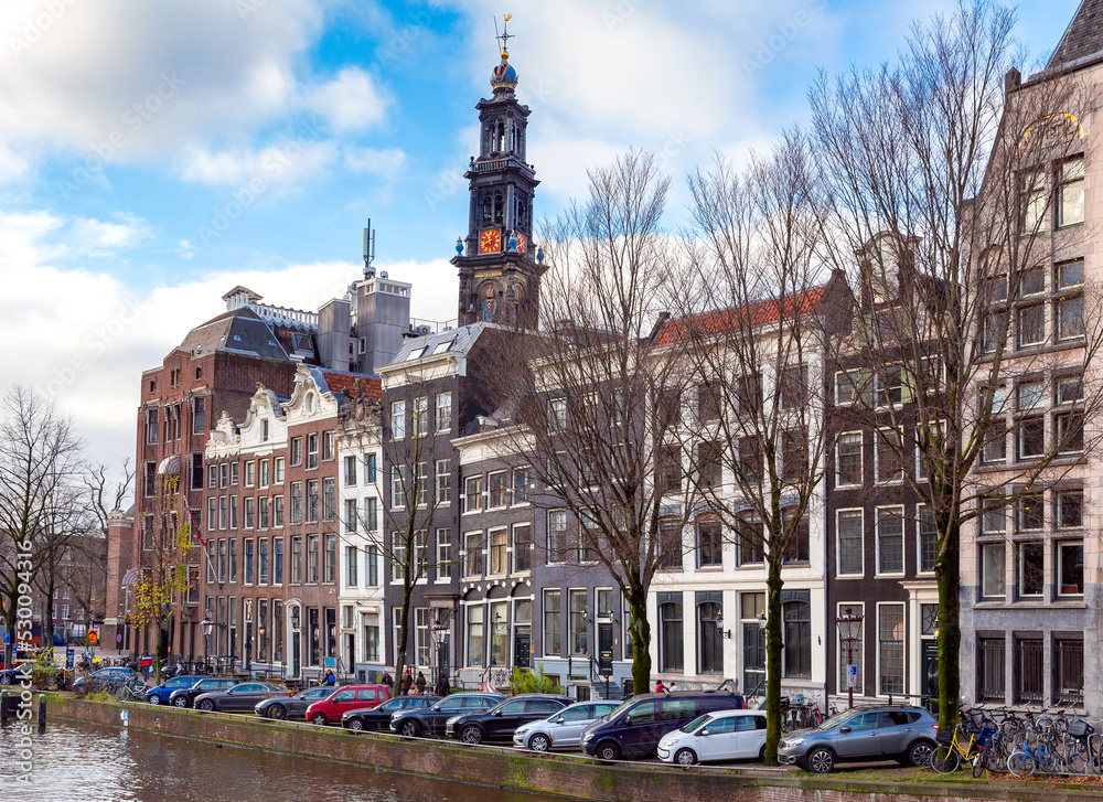 Obraz premium Beautiful old houses along the canal in Amsterdam.