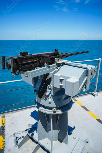 Automated machine gun on the deck of a military ship © bizoo_n