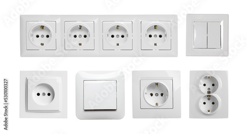 Set with modern plastic power sockets and light switches on white background. Banner design