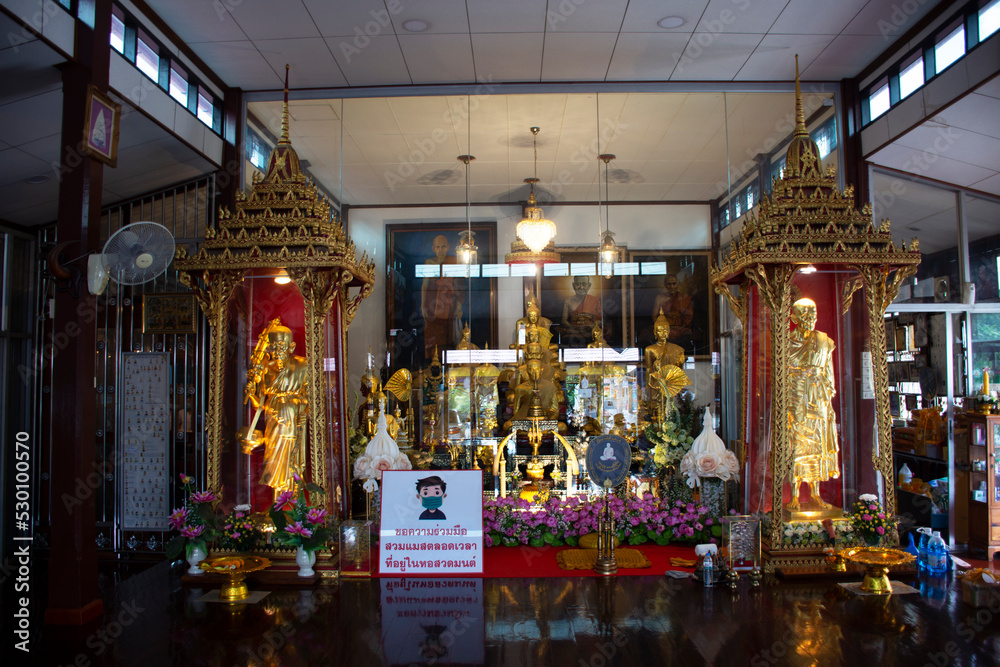Buddha statue and Luang Pu Doo monk statues for thai people travelers travel visit and respect praying blessing with worship holy mystery at Wat Sakae Temple on August 31, 2022 in Ayutthaya, Thailand