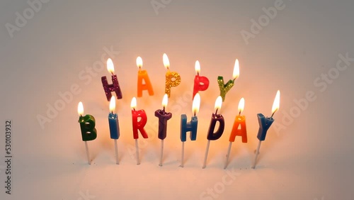 Happy Birthday Candles Burning White Background Yellow Flame photo