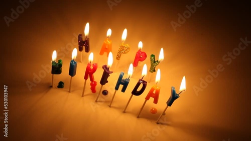 Happy Birthday Candles Burning White Background Yellow Flame photo