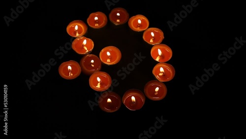 Dogecoin Symbol Made of Burning Votive Tea Candles photo