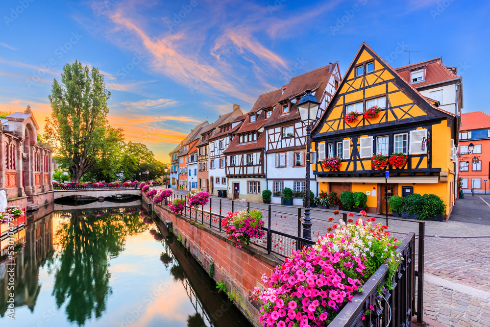 Colmar, Alsace, France. Petite Venice, water canal and traditional half timbered houses.
