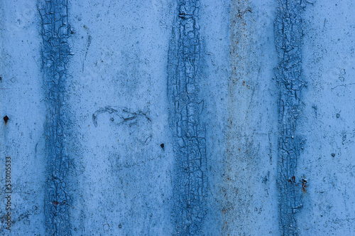 Abstract background of old weather and time damaged paint on the wall. photo