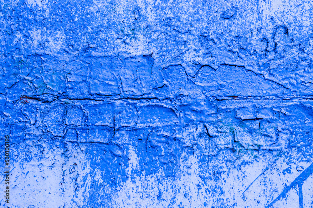 Abstract background from an old fenced wall in blue.
