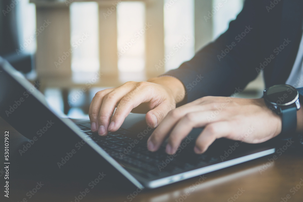 Close up of business people typing on keyboard notebook on the table. Close up of business people typing on keyboard notebook on the table.