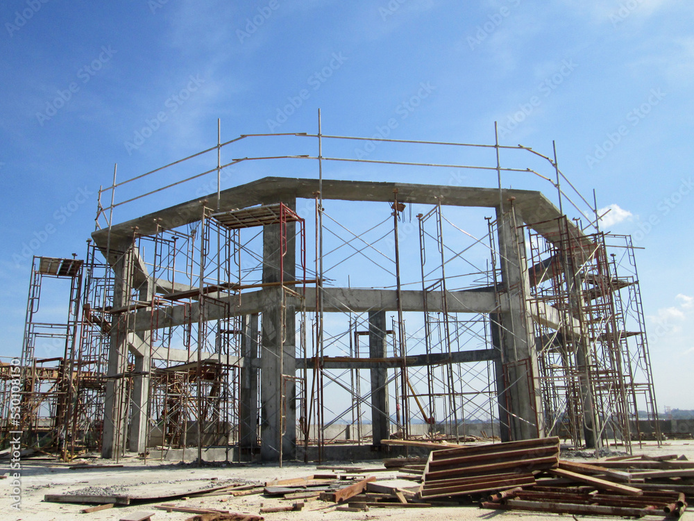 JOHOR, MALAYSIA -JUNE 6, 2022: Metal scaffolding is used as a temporary structure that supports works at the construction site. Also used as a structure for working at height outside the building.
JOHOR, MALAYSIA -JUNE 6, 2022: Metal scaffolding is used as a temporary structure that supports works at the construction site. Also used as a structure for working at height outside the building.