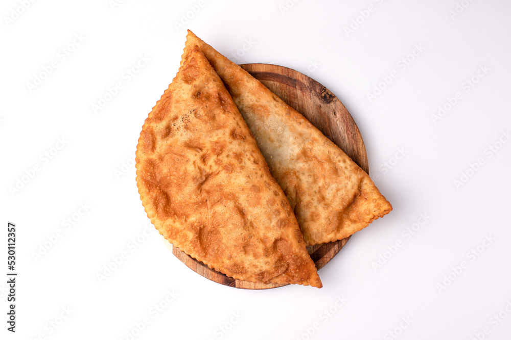 Cheburek, pasties with meat, food on a white background, isolated Cheburek, pasties with meat, food on a white background, isolated
