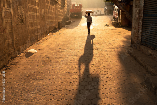 A boy walks in the street of Islamic Cairo, Egypt