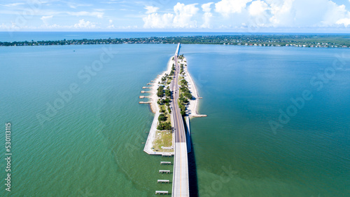 Картината върху платно Aerial Drone Perspective of the Causeway Bridge in Sanibel, Florida with the Bay
