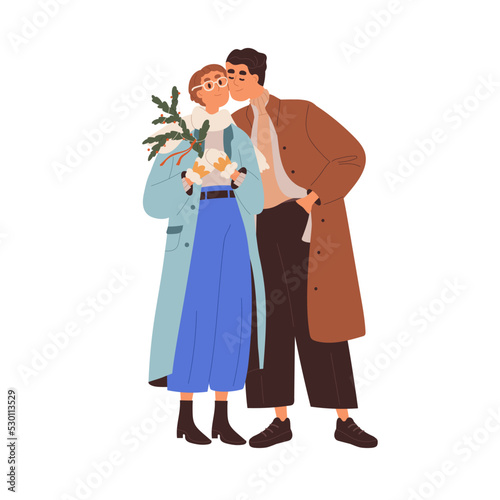 Love couple at Christmas time. Romantic man and woman at Xmas date outdoors. ...
