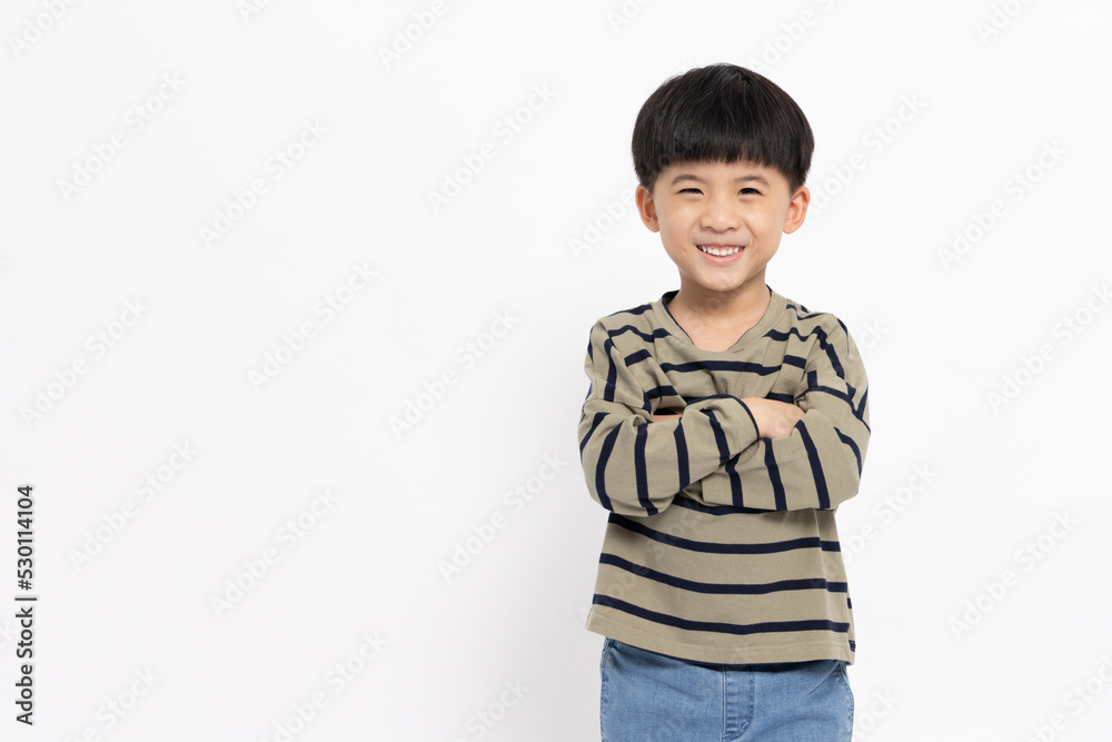 Asian little boy smilling with arms crossed isolated on white background Asian little boy smilling with arms crossed isolated on white background