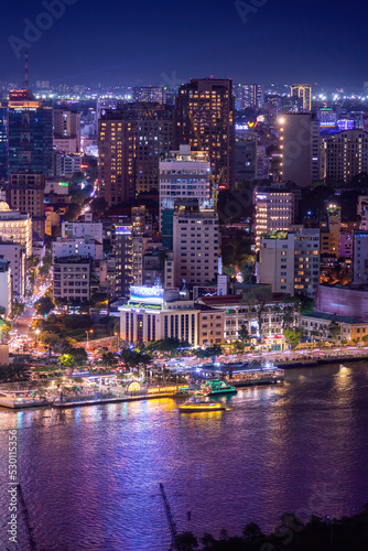 Aerial view of Bitexco Tower, buildings, roads, Thu Thiem 2 bridge and Saigon river in Ho Chi Minh city - Far away is Landmark 81 skyscraper. Travel concept.