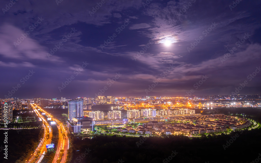 Fototapeta premium Aerial view of Bitexco Tower, buildings, roads, Thu Thiem 2 bridge and Saigon river in Ho Chi Minh city - Far away is Landmark 81 skyscraper. Travel concept.