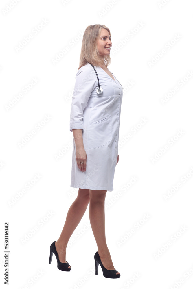 confident young woman doctor striding forward . isolated on a white background. confident young woman doctor striding forward . isolated on a white background.