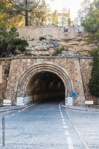 road to a dark tunnel