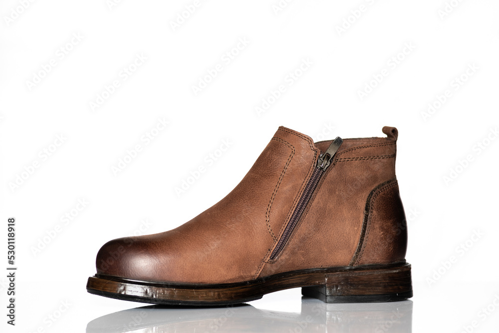 Men's autumn boots made of brown genuine leather isolated on a white background. Men's autumn boots made of brown genuine leather isolated on a white background.