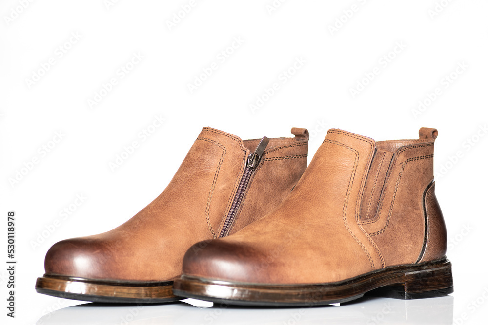 Men's autumn boots made of brown genuine leather isolated on a white background.
