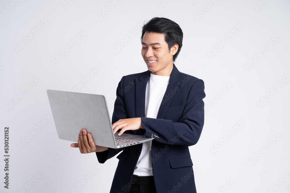 Young business man wearing a suit posing on a white background Young business man wearing a suit posing on a white background