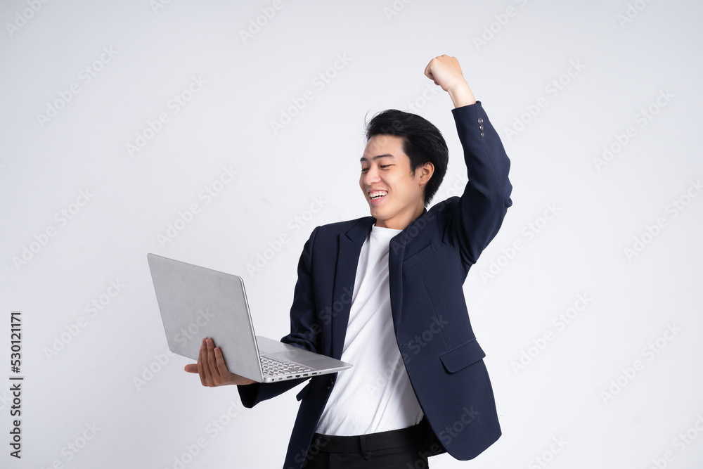 Young business man wearing a suit posing on a white background Young business man wearing a suit posing on a white background