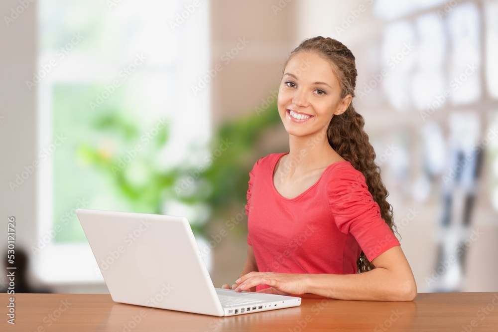 Young woman work or study and using computer. Young woman work or study and using computer.