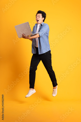 full body image of asian man posing on yellow background