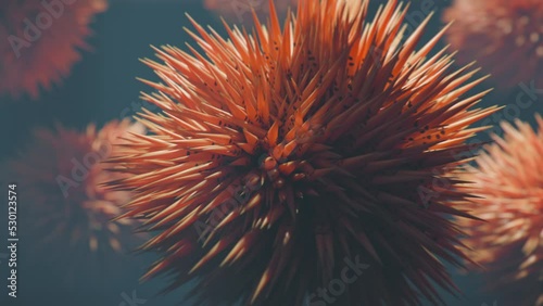 Orange urchin-like alien lifeform swimming underwater.