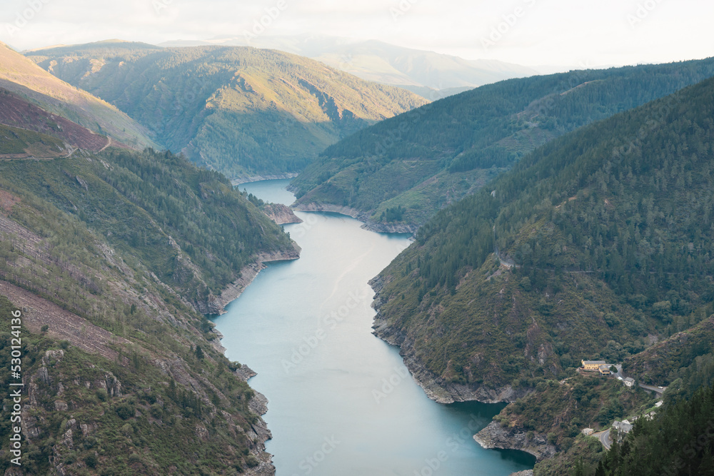 Views of the Salime reservoir from Paicega. Landscape of river and mountains.