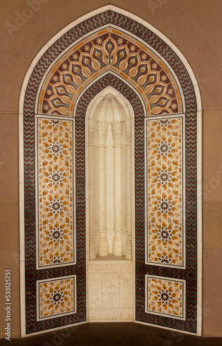 Arabian style background in brown yellow colors. Oriental eastern ornament, Muscat, Oman. Sultan Qaboos Grand Mosque