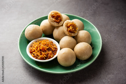 kozhukatta or kolukattai pidi is Steamed dumplings made with rice flour, filling coconut, jaggery photo