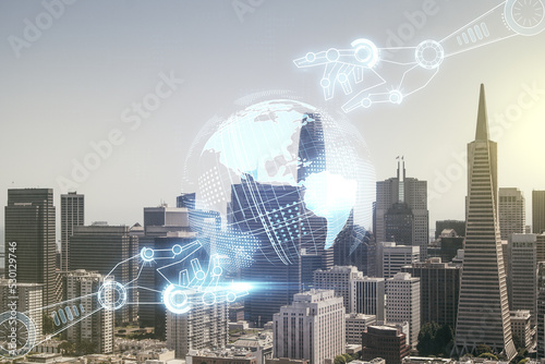 Double exposure of abstract virtual robotics technology with world map hologram on San Francisco city skyscrapers background. Research and development software concept