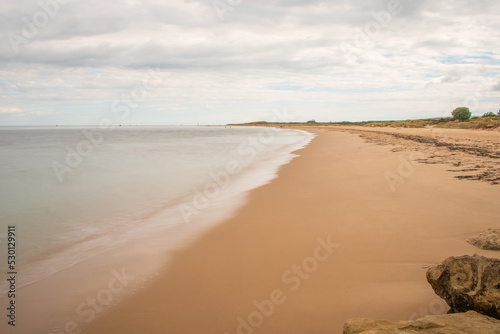 A long exposure of Sandbanks Dorset Empty beach near the ferry on a bright September morning