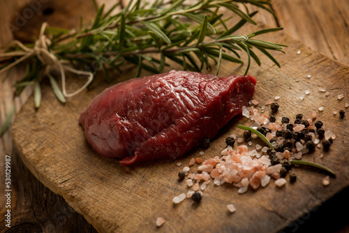 raw tenderloin with ingredients over cutting board #530129987