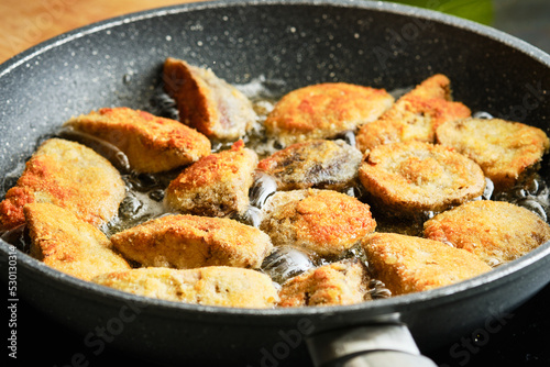 Cooking fried mushrooms on frying pan