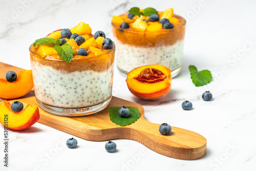 peaches blueberry chia yogurt. Homemade dessert with fruits. place for text, top view