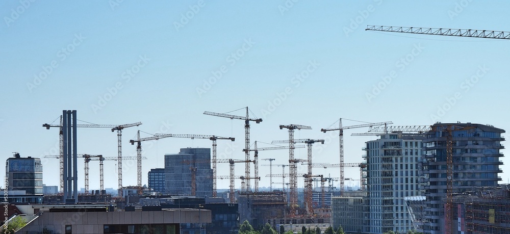 cranes over a city under construction