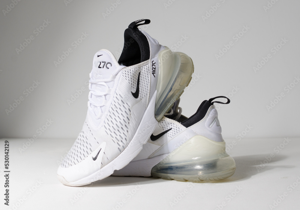 london, 05.08.2020 Nike Air Max 270 white low weight running trainers. Nike air contemporary sneaker trainers. Nike and street wear fashionable athletic apparel. Isolated nikes. Stock Photo Adobe Stock