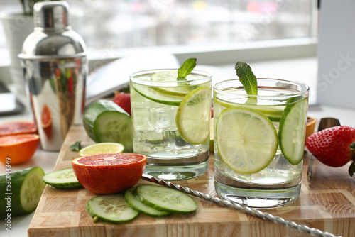 Preparation of chilled lime with cucumber punch homemade cocktail closeup